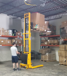 ldr employee uses pallet stacker to store pallets of fba inventory